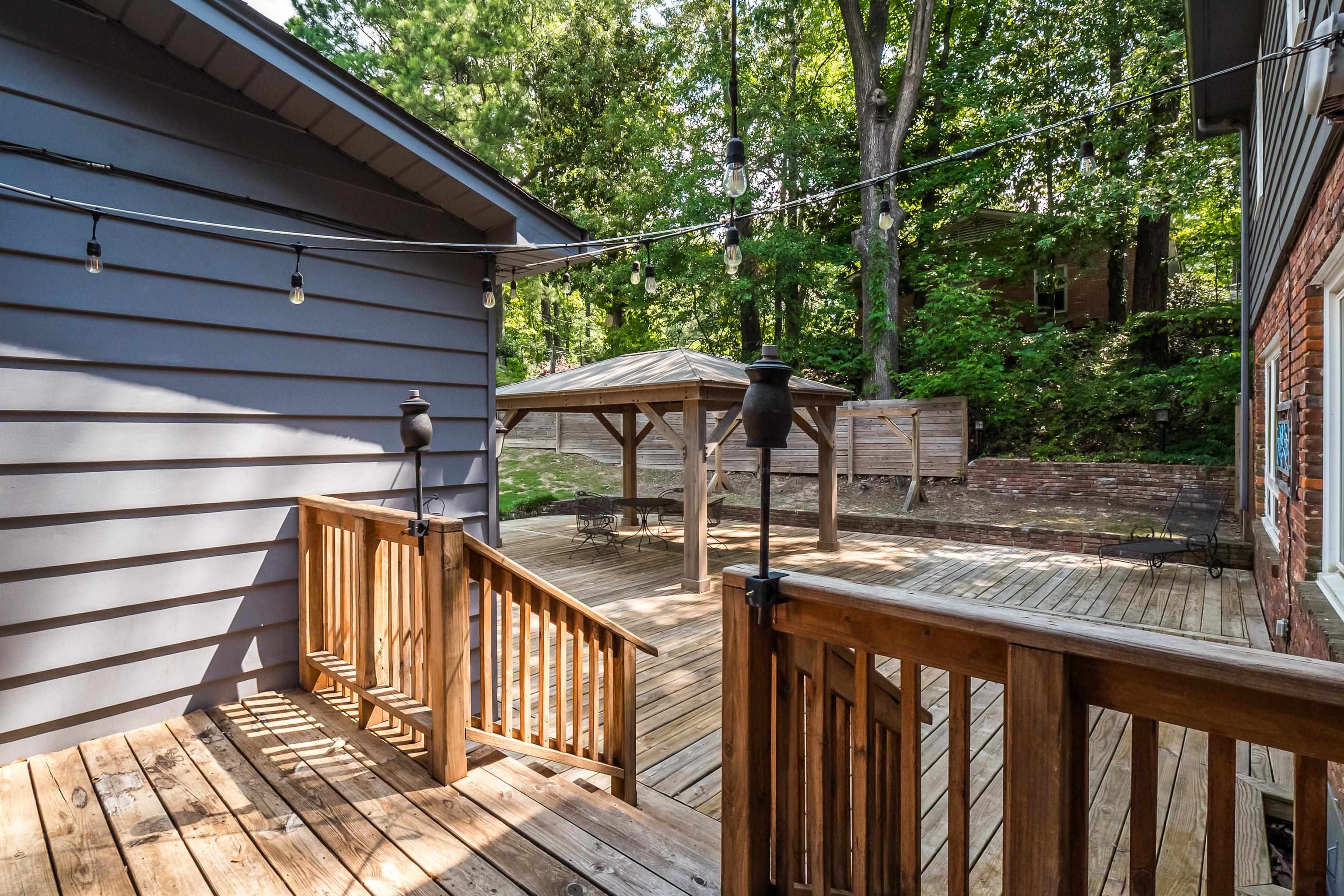 5644 Walnut Grove Road Memphis, TN 38120 - Photo 28 of 34 a view of house with wooden deck and furniture