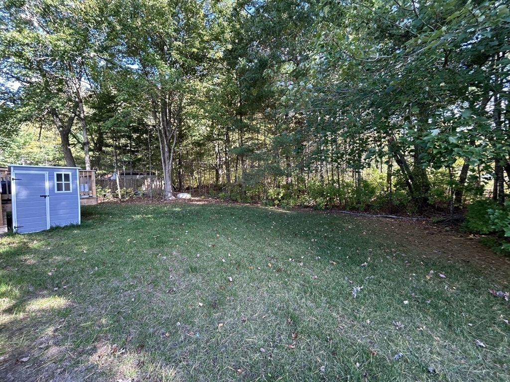 41 Longboat Road Wareham, MA 02576 - Photo 13 of 15 a view of a yard with large trees