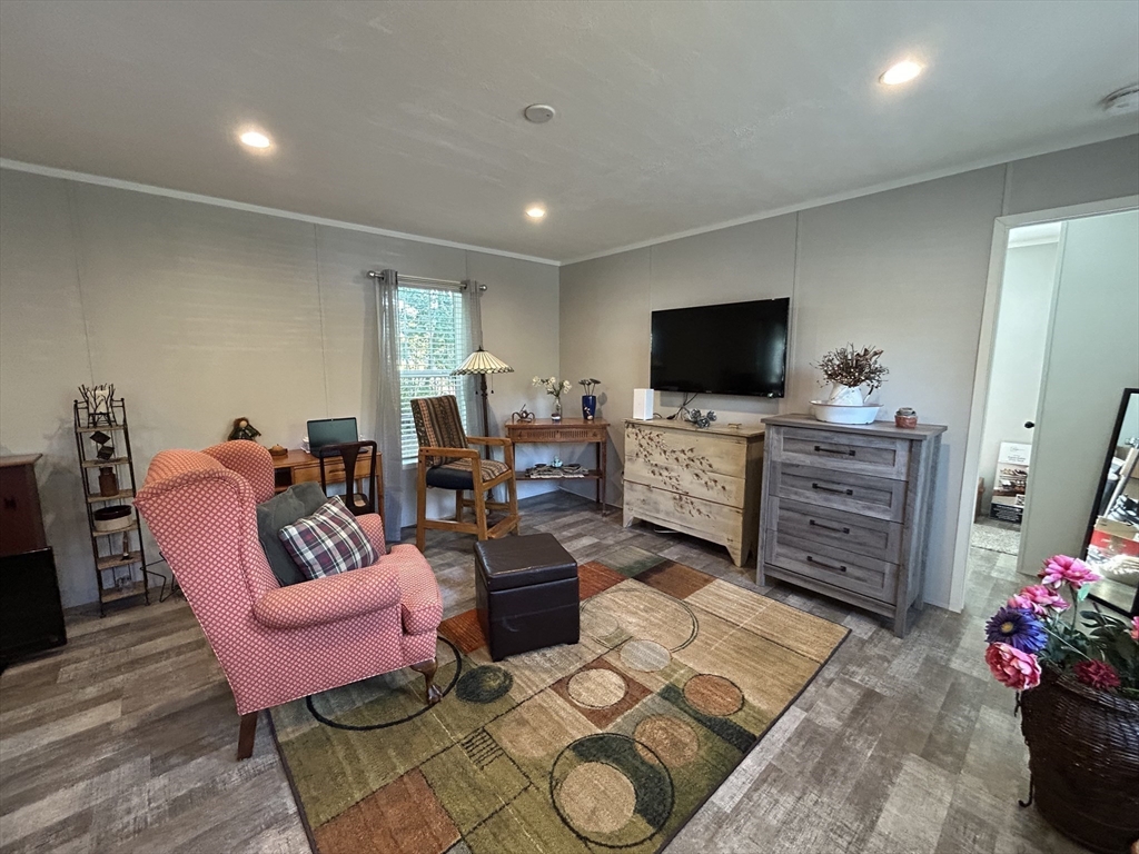41 Longboat Road Wareham, MA 02576 - Photo 2 of 15 a living room with furniture and a flat screen tv