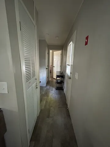 a view of a hallway with a livingroom