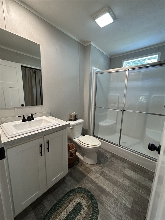 41 Longboat Road Wareham, MA 02576 - Photo 5 of 15 a bathroom with a sink toilet and shower