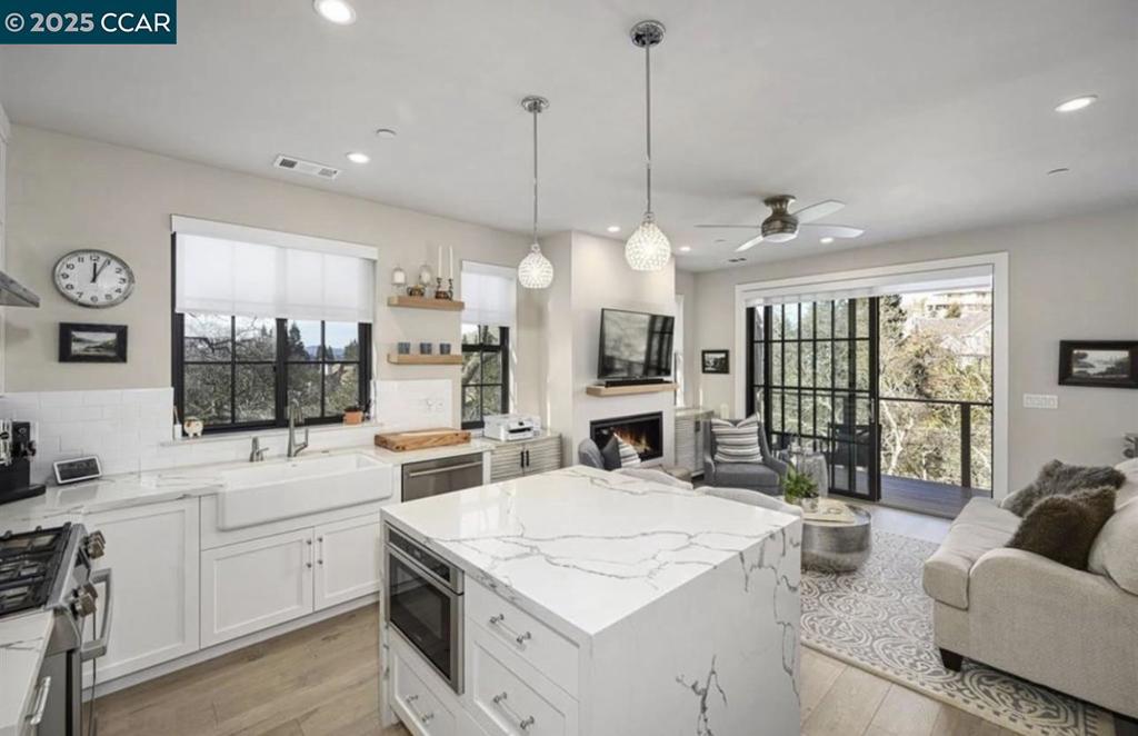 Undisclosed Address Alamo, CA 94507 - Photo 1 of 8 a kitchen with stainless steel appliances granite countertop a stove and a large window