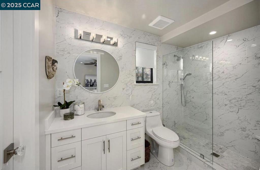 Undisclosed Address Alamo, CA 94507 - Photo 6 of 8 a bathroom with a toilet sink and shower