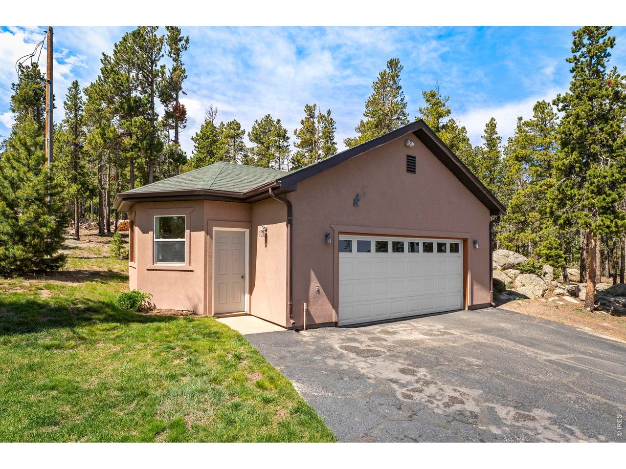 1109 Indian Peak Road Golden, CO 80403 - Photo 29 of 50 Detached garage with paved driveway for easy maintenance