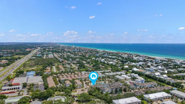 a view of house with yard and ocean view