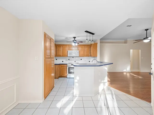 a kitchen with a sink cabinets and counter space