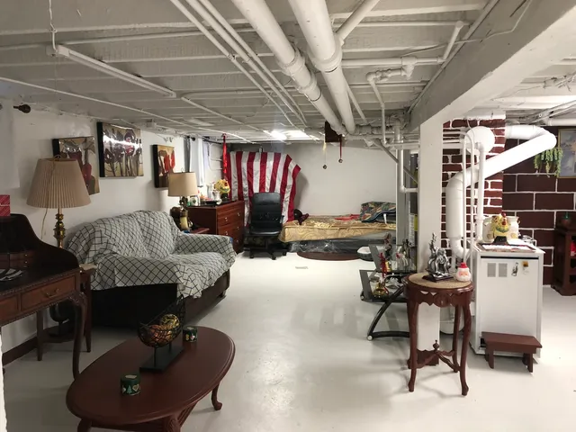 a room with gym equipment and a view of pool