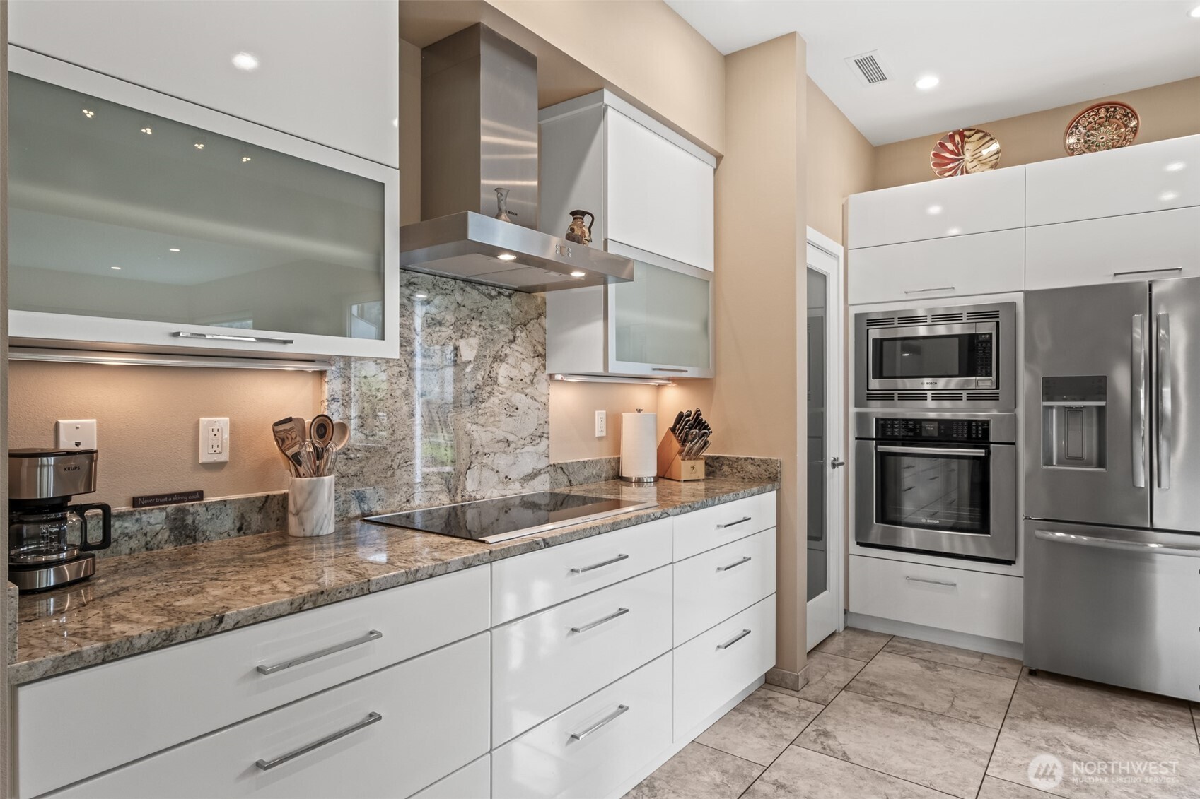 10202 Titus Road Leavenworth, WA 98826 - Photo 15 of 39 a kitchen with stainless steel appliances kitchen island granite countertop a refrigerator and a sink