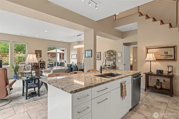 a view of a kitchen counter top space cabinets and living room view
