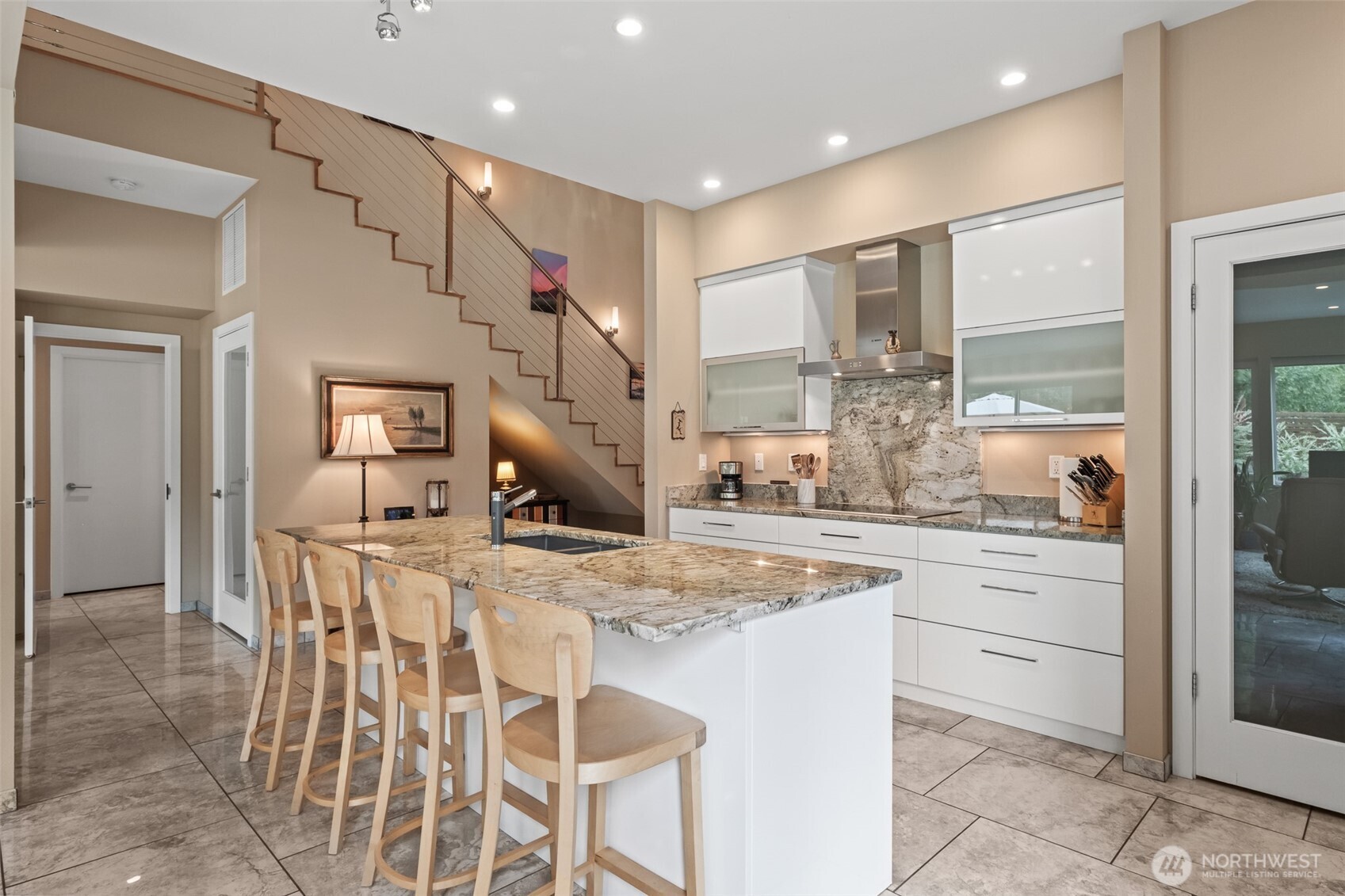 10202 Titus Road Leavenworth, WA 98826 - Photo 18 of 39 a kitchen with kitchen island granite countertop a stove and white cabinets