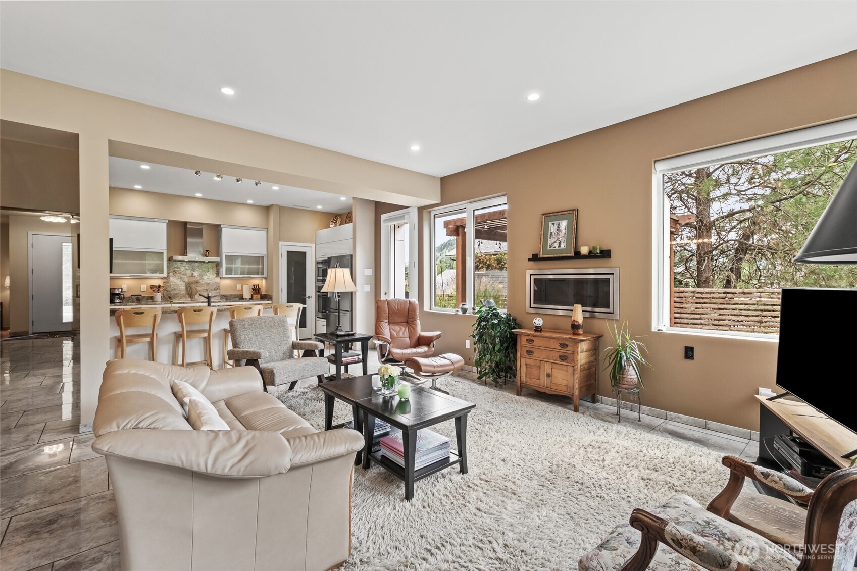 10202 Titus Road Leavenworth, WA 98826 - Photo 23 of 39 a living room with fireplace furniture and a flat screen tv
