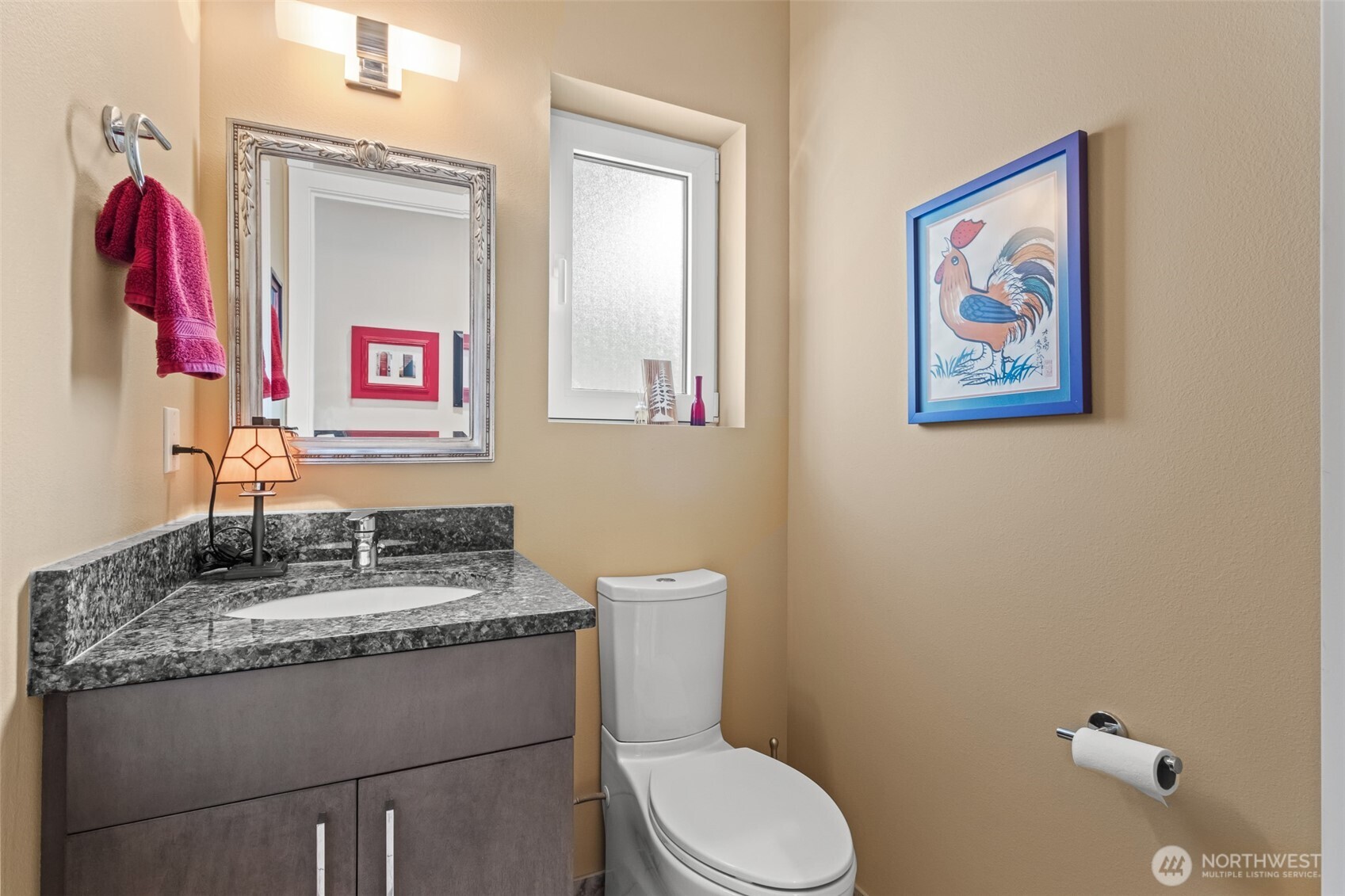 10202 Titus Road Leavenworth, WA 98826 - Photo 37 of 39 a bathroom with a toilet a sink and a mirror