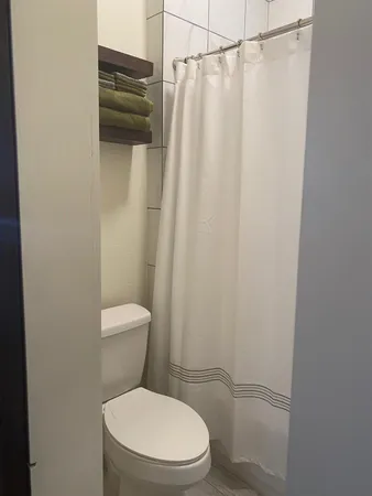 a bathroom with a sink a mirror and a shower
