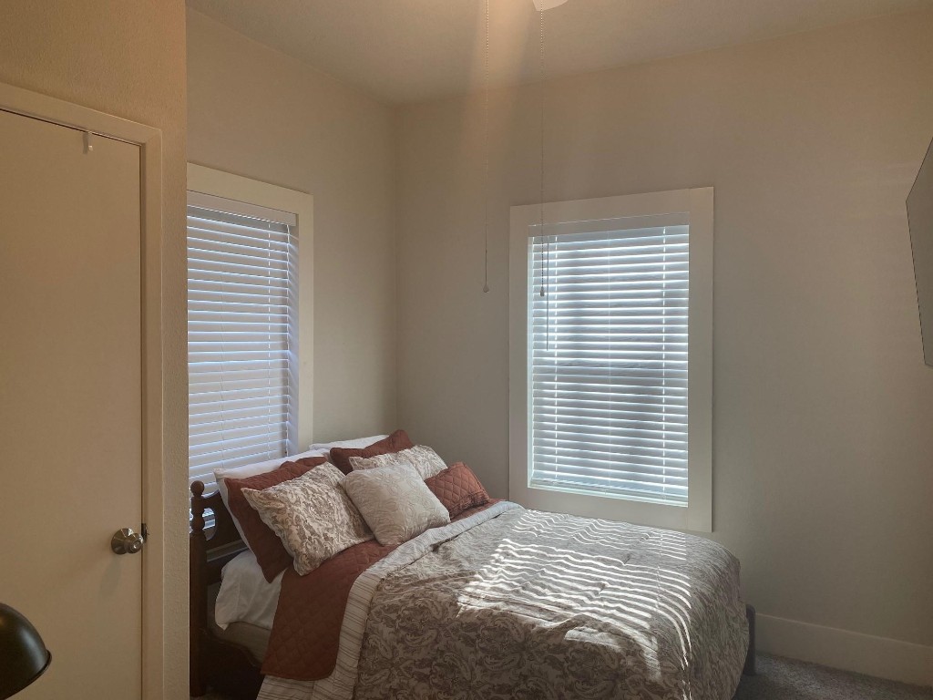 2708 Winbern Street Houston, TX 77004 - Photo 16 of 17 a bedroom with a bed and a window