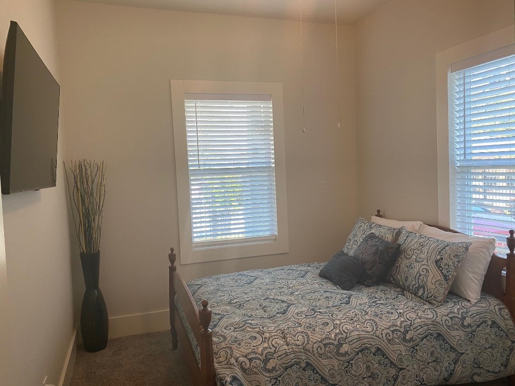 2708 Winbern Street Houston, TX 77004 - Photo 7 of 17 a bedroom with a bed and a window