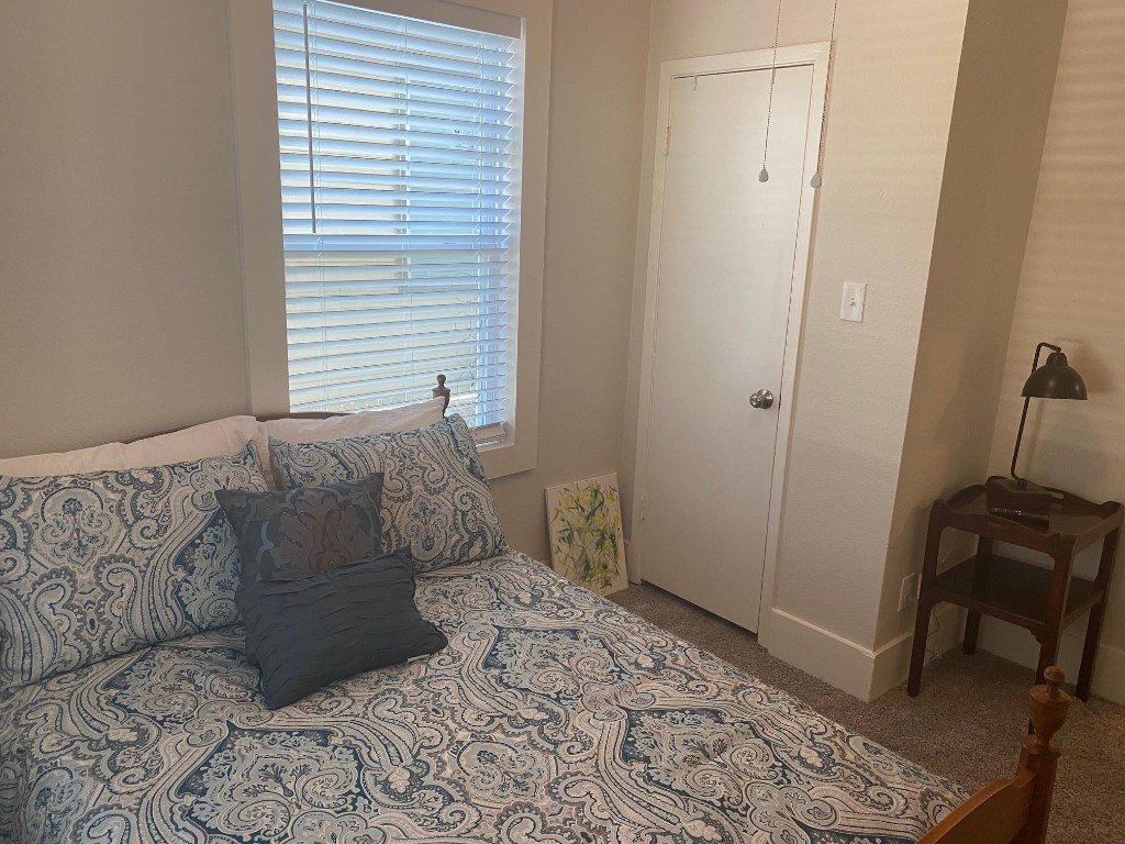 2708 Winbern Street Houston, TX 77004 - Photo 8 of 17 a bedroom with a bed and a window