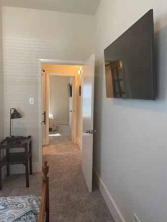 a view of a bathroom from a hallway