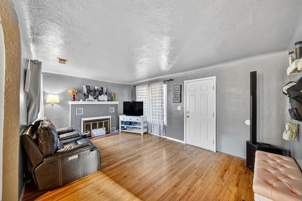 2126 Tulare Street Selma, CA 93662 - Photo 12 of 40 a bedroom with furniture and a fireplace