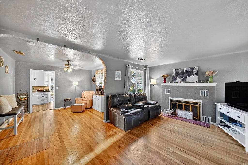 2126 Tulare Street Selma, CA 93662 - Photo 13 of 40 a living room with furniture and a fireplace