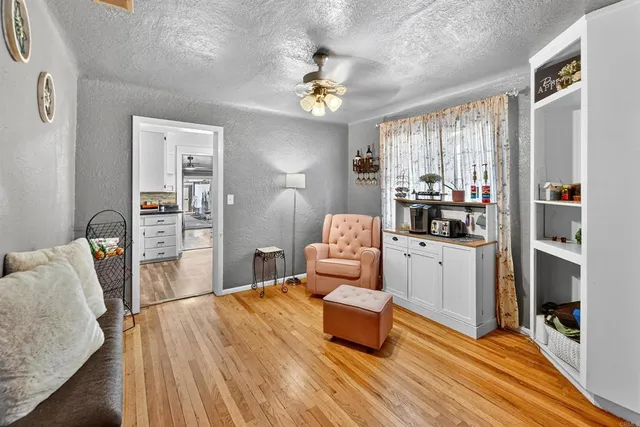 a bedroom with furniture and wooden floor