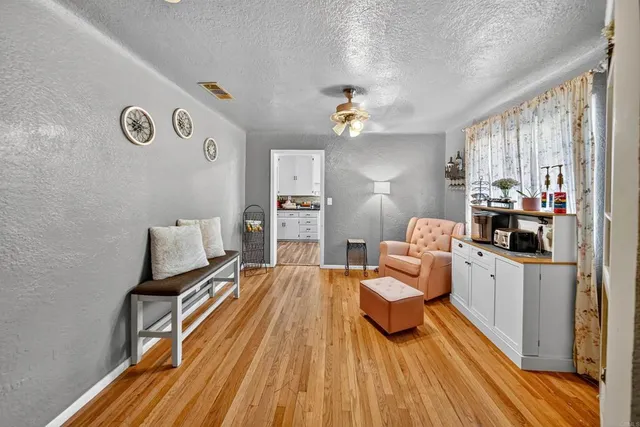 a living room with furniture fireplace and flat screen tv