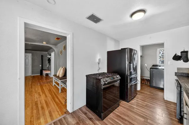 a kitchen with counter top space and cabinets