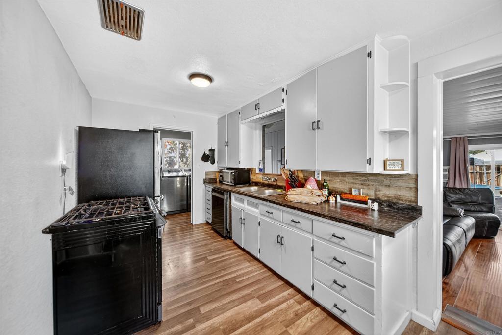 2126 Tulare Street Selma, CA 93662 - Photo 18 of 40 a kitchen with counter top space and cabinets