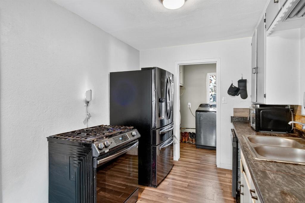 2126 Tulare Street Selma, CA 93662 - Photo 19 of 40 a kitchen with a refrigerator and a stove top oven
