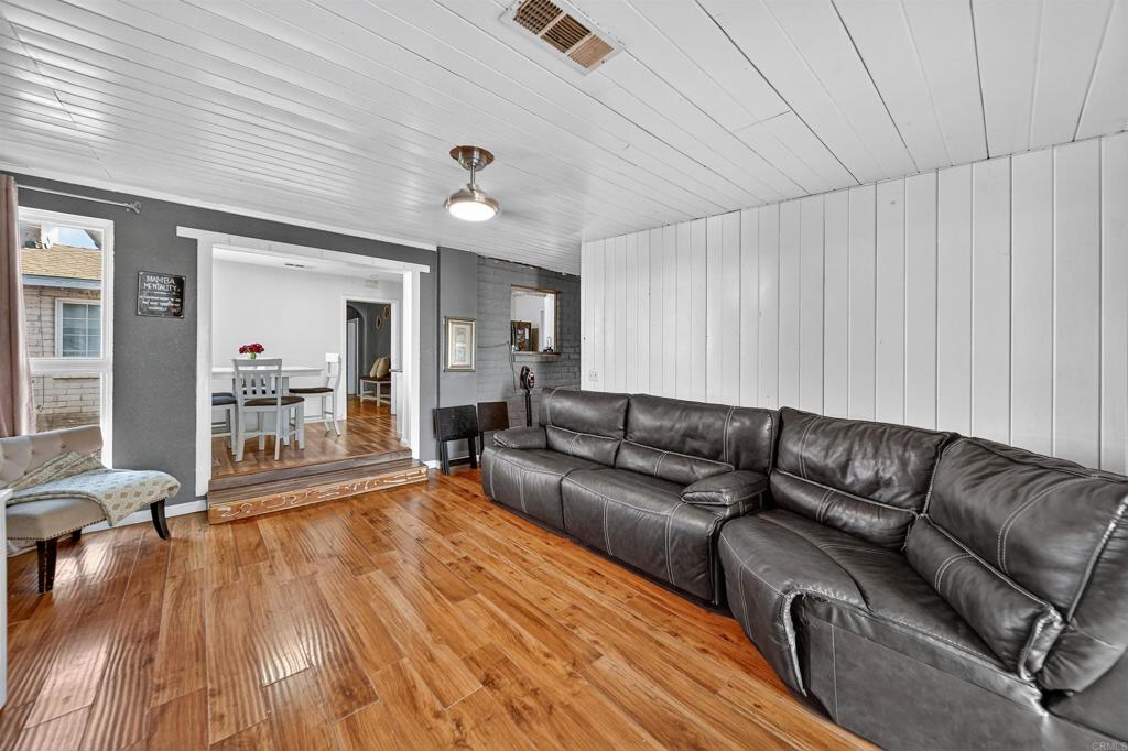 2126 Tulare Street Selma, CA 93662 - Photo 24 of 40 a living room with furniture and a wooden floor