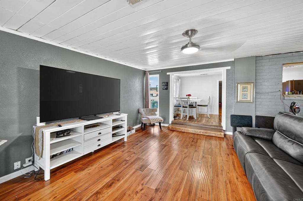 2126 Tulare Street Selma, CA 93662 - Photo 26 of 40 a living room with furniture and a flat screen tv