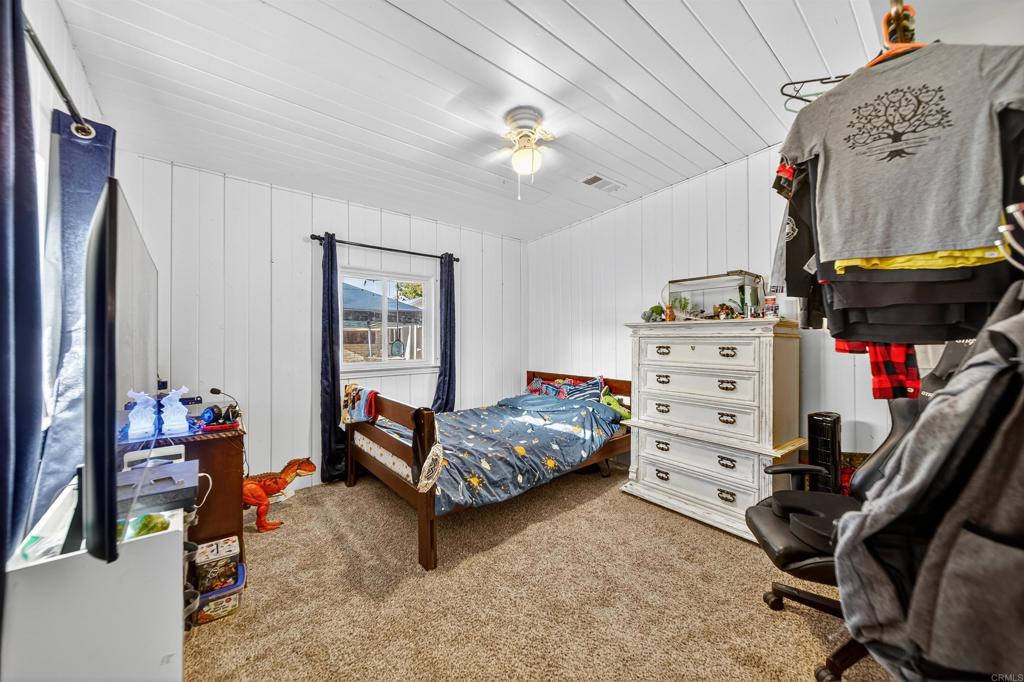 2126 Tulare Street Selma, CA 93662 - Photo 29 of 40 a bedroom with furniture and a mirror