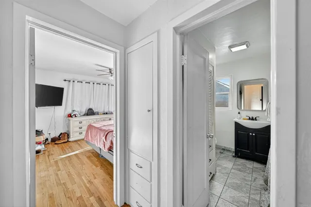 a bathroom with a tub shower and sink