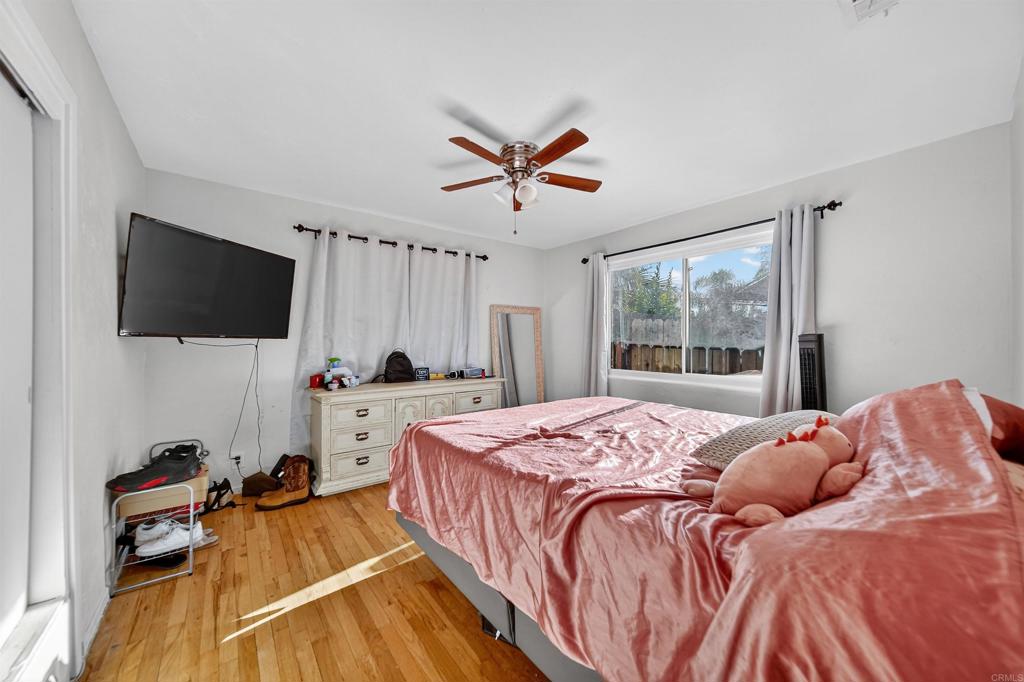 2126 Tulare Street Selma, CA 93662 - Photo 34 of 40 a bedroom with a bed and a flat screen tv