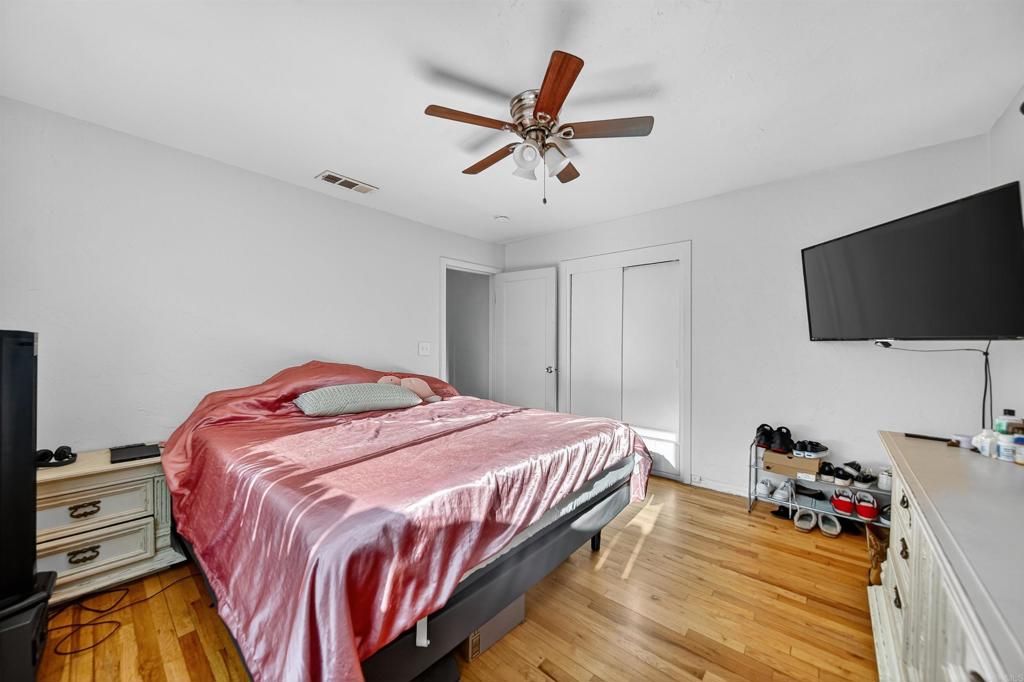 2126 Tulare Street Selma, CA 93662 - Photo 35 of 40 a bedroom with a bed and a flat screen tv