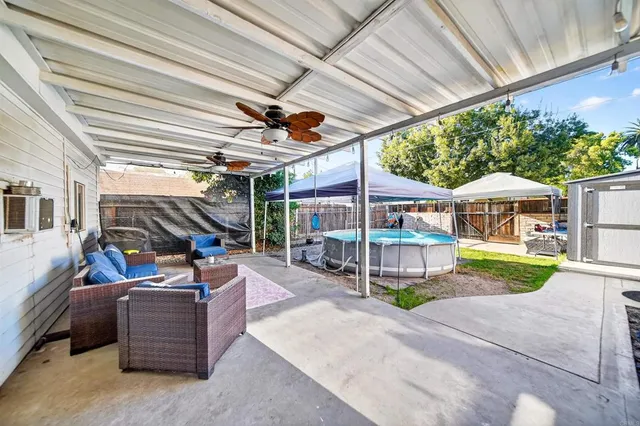 a view of a house with backyard and porch