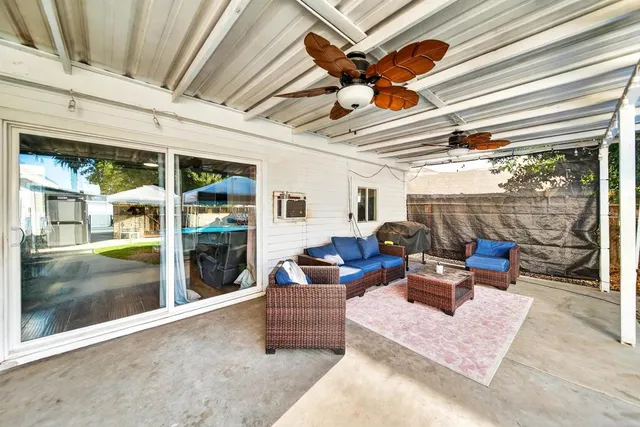 a outdoor living space with patio furniture and garden view