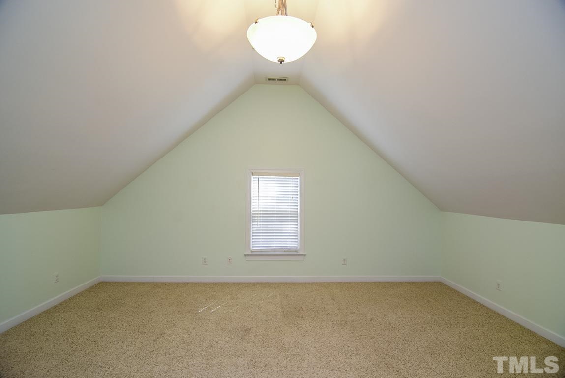 3813 April Place Raleigh, NC 27612 - Photo 12 of 25 This large bedroom has cathedral ceilings, updated fixture and would also make a grand office.
