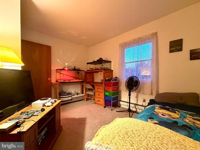 a room with furniture and gym equipment