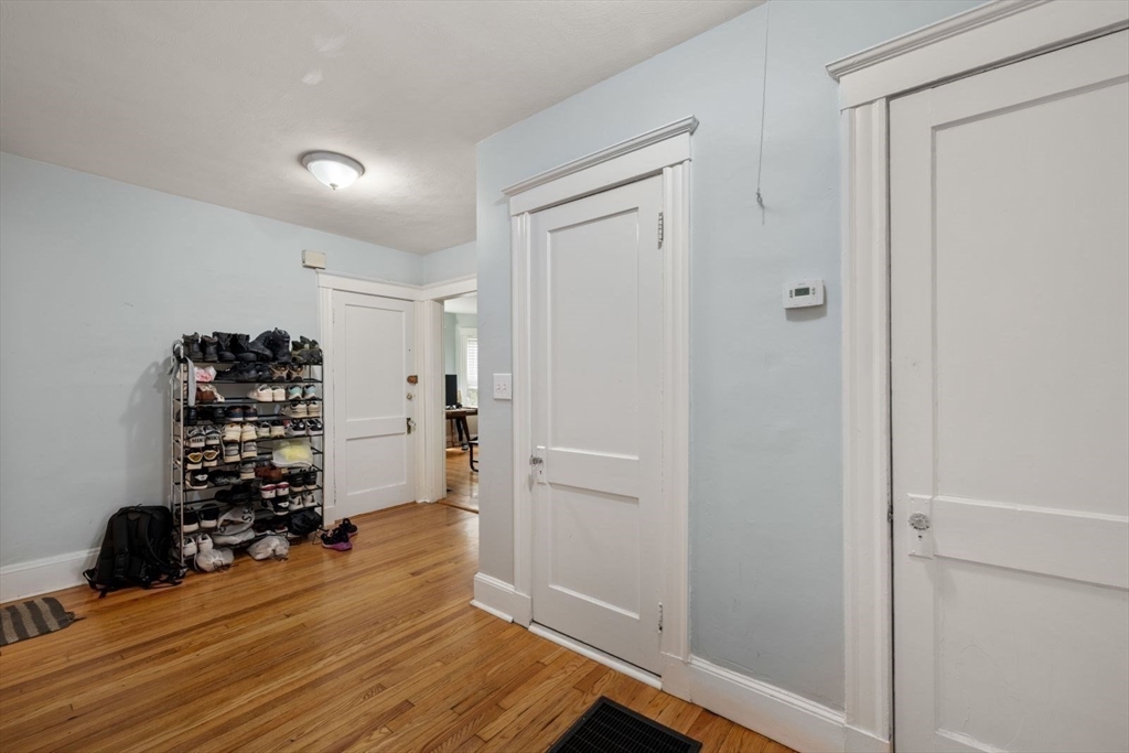 18 Claymoss Road, Unit 1 Boston, MA 02135 - Photo 18 of 24 a room with wooden floor and closet