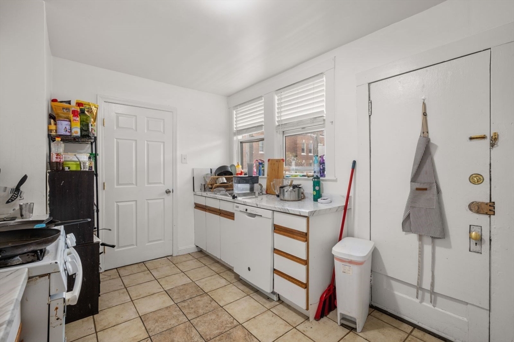 18 Claymoss Road, Unit 1 Boston, MA 02135 - Photo 2 of 24 a kitchen with a sink appliances and cabinets