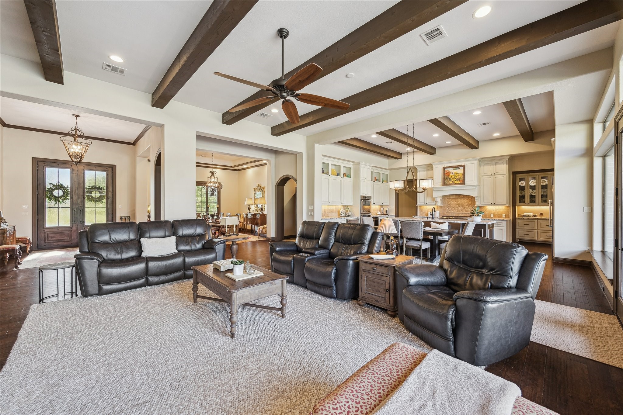 11 Willowcreek Ranch Road Tomball, TX 77377 - Photo 48 of 48 a living room with lots of furniture and a chandelier
