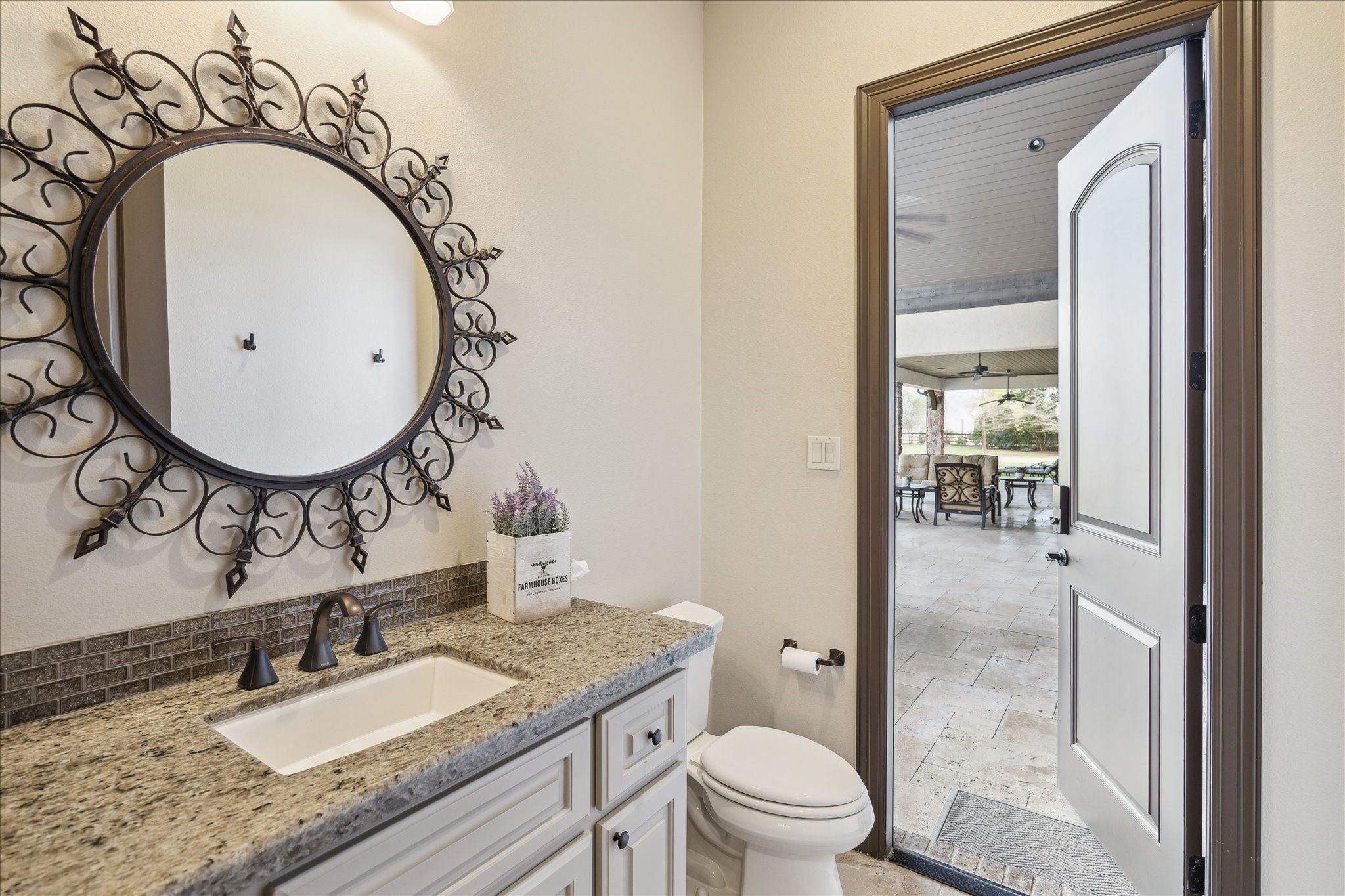 11 Willowcreek Ranch Road Tomball, TX 77377 - Photo 24 of 48 a bathroom with a granite countertop sink mirror vanity and toilet