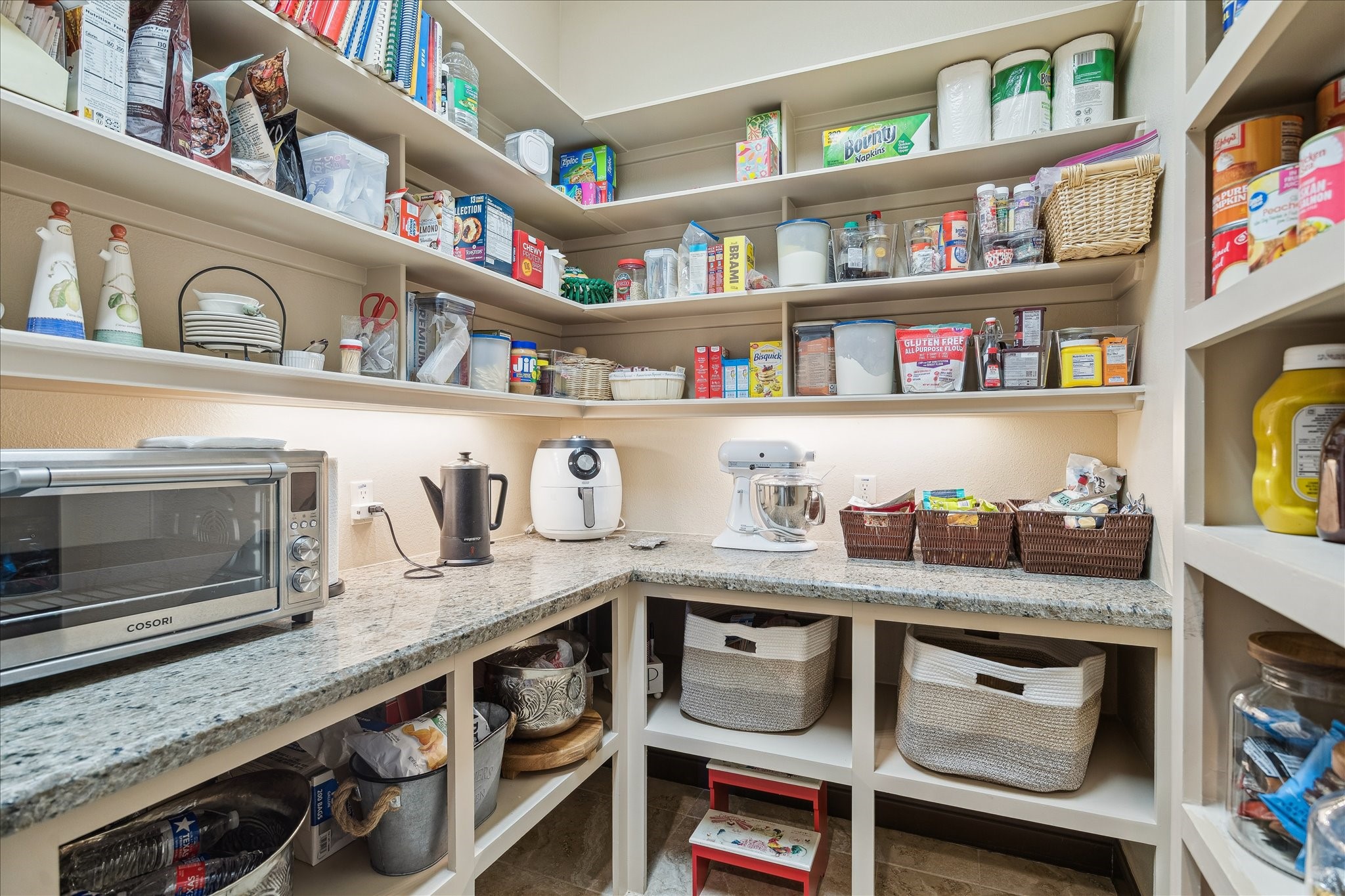 11 Willowcreek Ranch Road Tomball, TX 77377 - Photo 28 of 49 A large oversized walk in pantry complements the kitchen. It features high and low storage as well as granite countertop work space, electrical outlets for storing and utilizing small applances as well as undercabinet lighting.