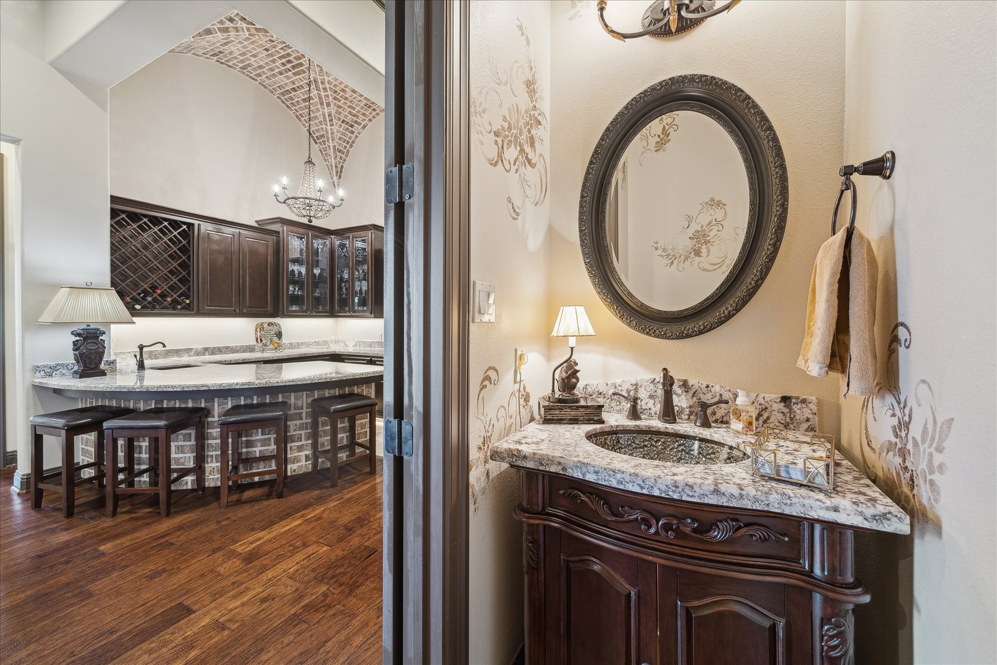 11 Willowcreek Ranch Road Tomball, TX 77377 - Photo 38 of 49 A powder bath is discreetly tucked just off the entertainer's bar to be quickly and easily accessed by guests.