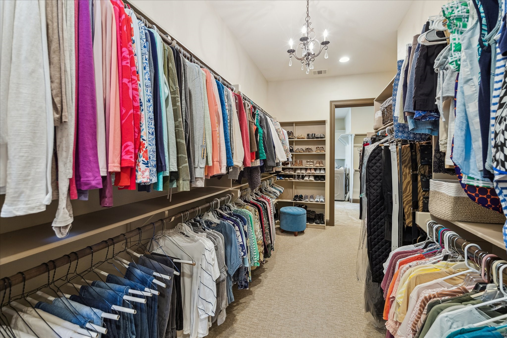 11 Willowcreek Ranch Road Tomball, TX 77377 - Photo 40 of 48 a view of walk in closet with clothes