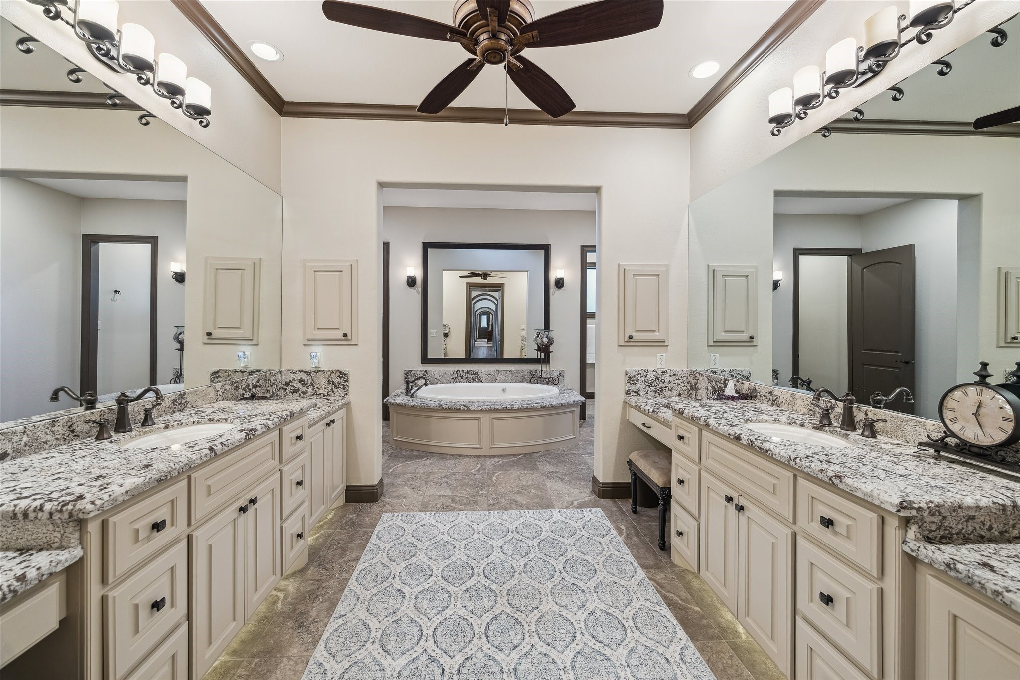 11 Willowcreek Ranch Road Tomball, TX 77377 - Photo 40 of 49 The spa-like primary bathroom features his and her separate sinks and vanities, providing each with her own space.