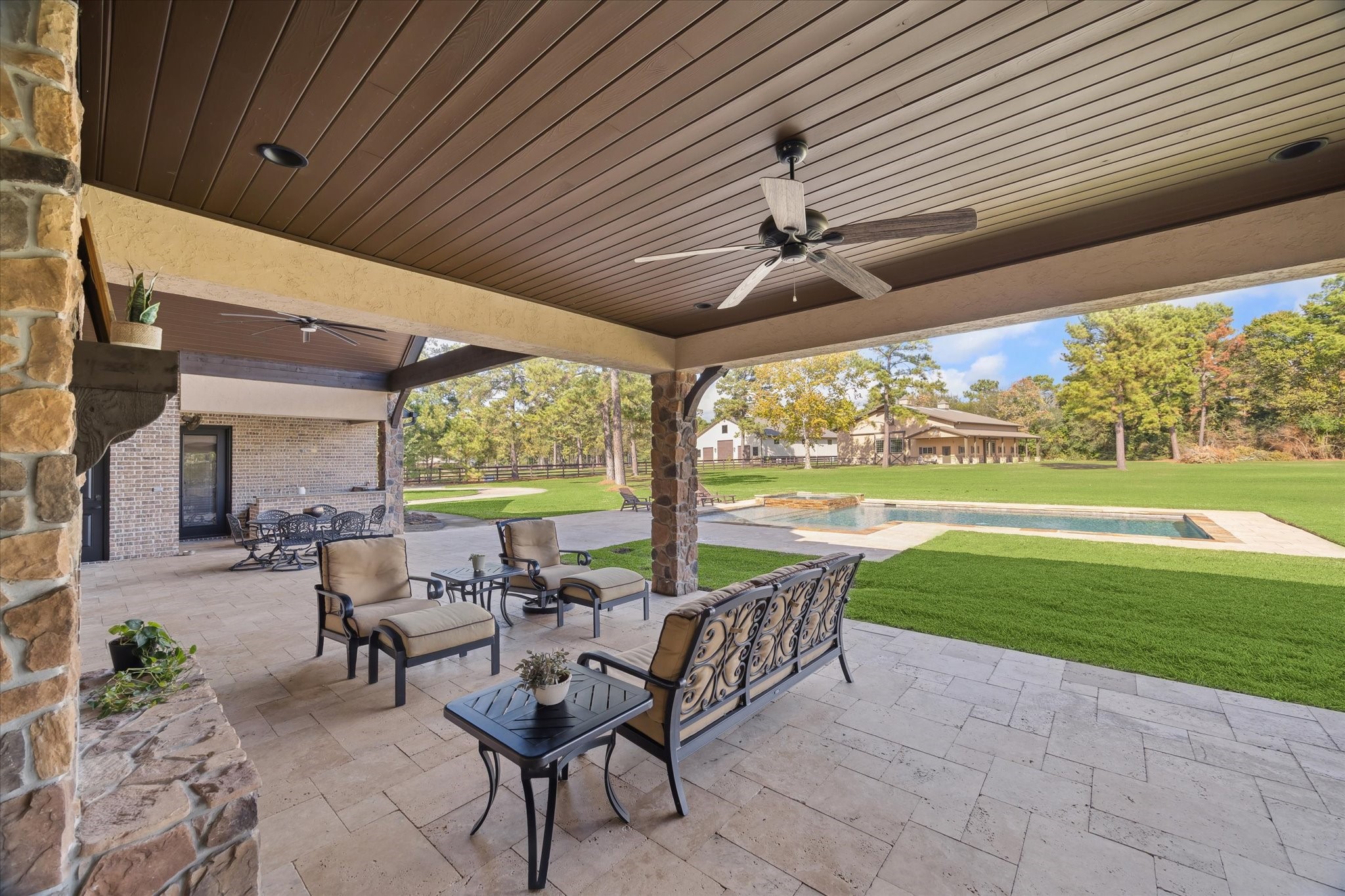 11 Willowcreek Ranch Road Tomball, TX 77377 - Photo 45 of 48 a view of a patio with a table chairs and backyard