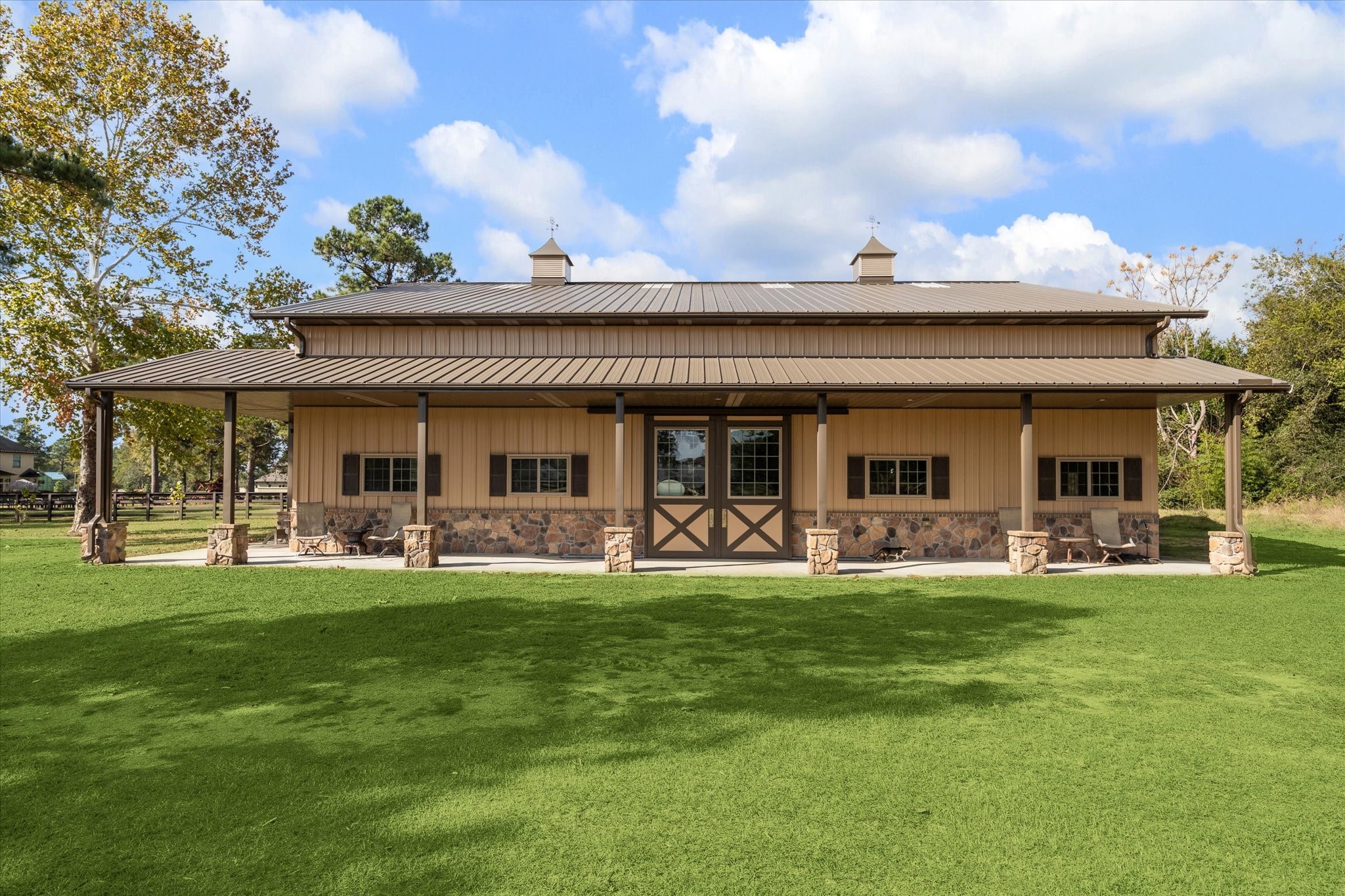 11 Willowcreek Ranch Road Tomball, TX 77377 - Photo 9 of 49 Another view of this functional yet beautiful barn tucked behind the property overlooking the open pasture!