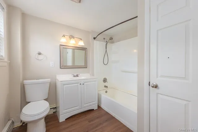a bathroom with a toilet sink shower and bathtub