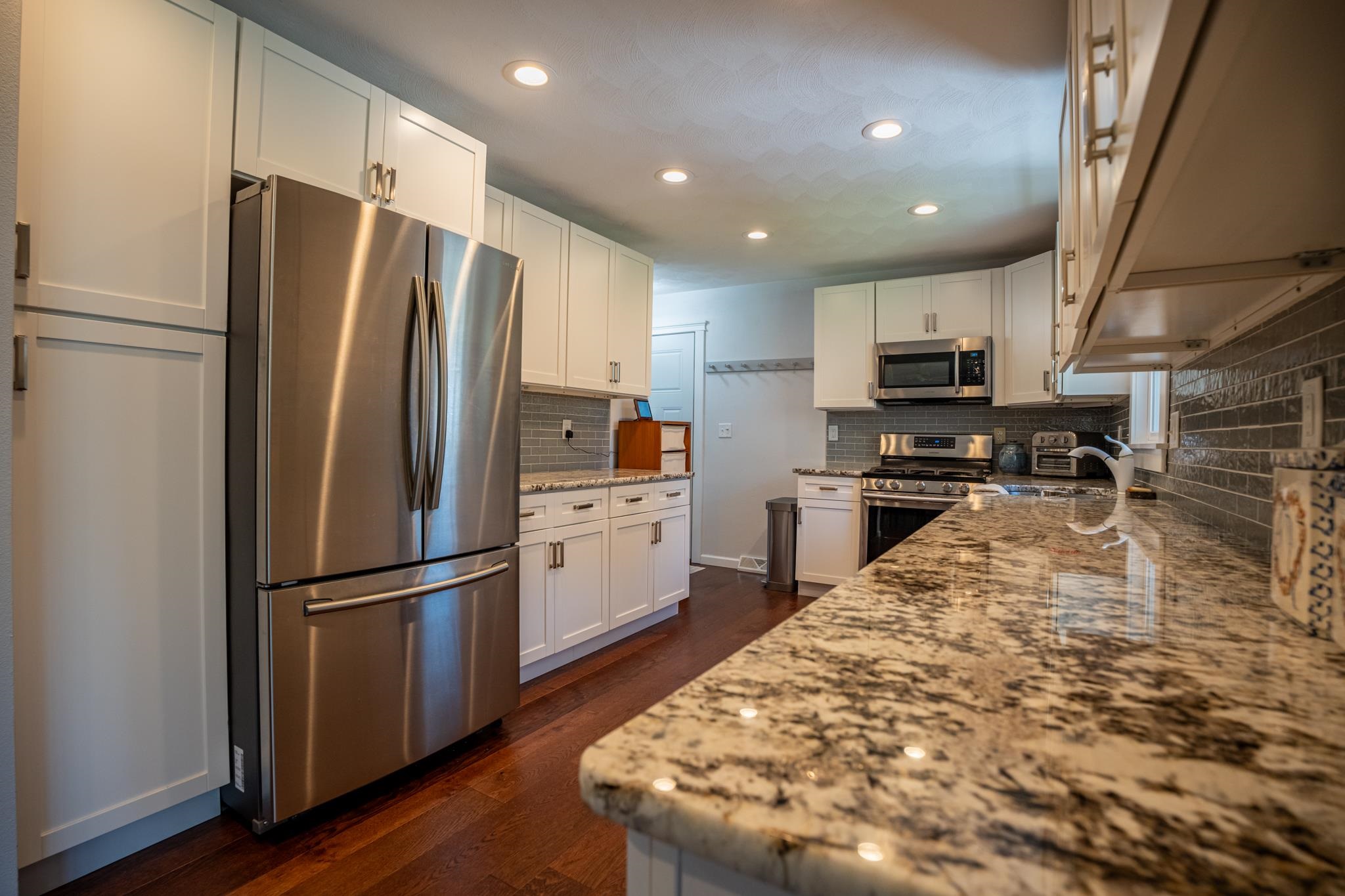 5968 East Bradley Road Byron, IL 61010 - Photo 14 of 40 a kitchen with kitchen island a counter top space stainless steel appliances and cabinets